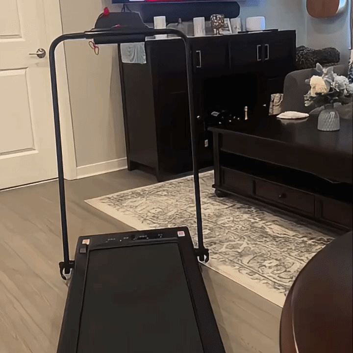 Walking on the foldable treadmill while working from home